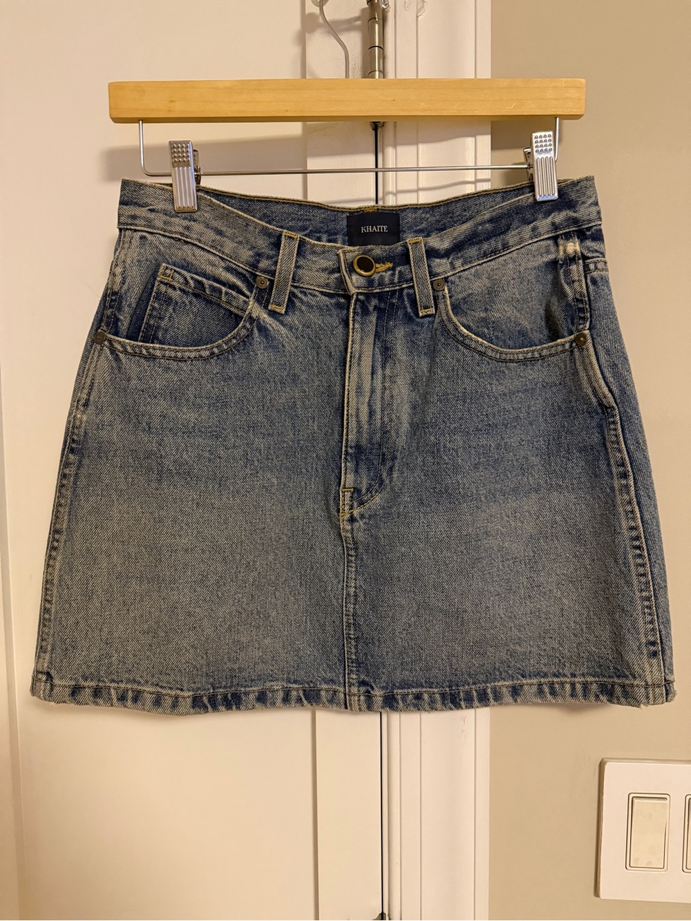 KHAITE Dolly Denim Mini Skirt in Berkeley